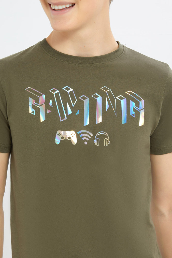 Redtag-Boys-Olive-Gamer-Gel-Print-Tee-BSR-T-Shirts,-Category:T-Shirts,-Colour:Green,-Deals:New-In,-Dept:Boys,-Filter:Senior-Boys-(8-to-14-Yrs),-H1:KWR,-H2:BSR,-H3:TSH,-H4:TSH,-New-In-BSR-APL,-Non-Sale,-RMD,-S23C,-Season:S23C,-Section:Boys-(0-to-14Yrs)-Senior-Boys-9 to 14 Years