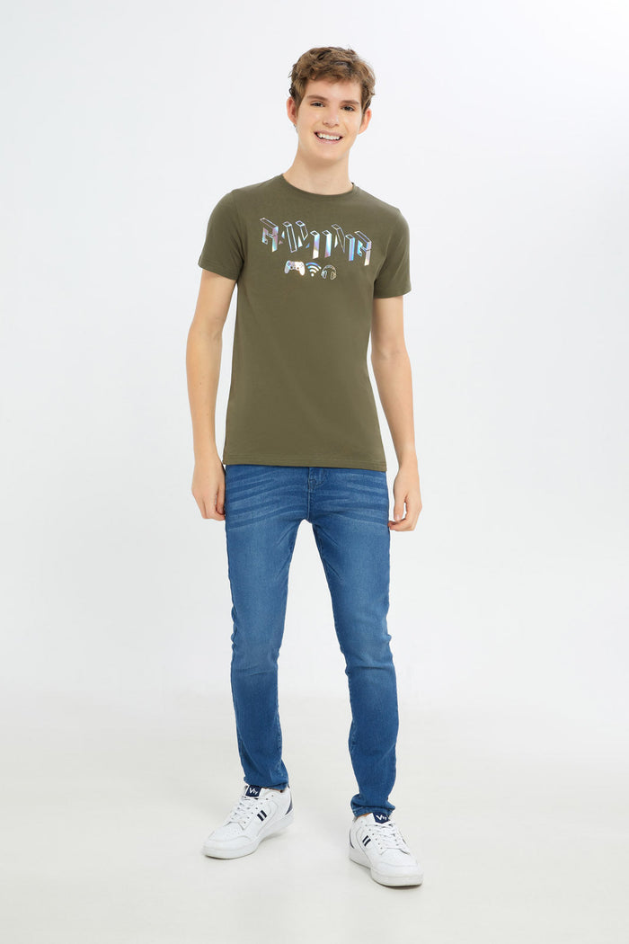 Redtag-Boys-Olive-Gamer-Gel-Print-Tee-BSR-T-Shirts,-Category:T-Shirts,-Colour:Green,-Deals:New-In,-Dept:Boys,-Filter:Senior-Boys-(8-to-14-Yrs),-H1:KWR,-H2:BSR,-H3:TSH,-H4:TSH,-New-In-BSR-APL,-Non-Sale,-RMD,-S23C,-Season:S23C,-Section:Boys-(0-to-14Yrs)-Senior-Boys-9 to 14 Years